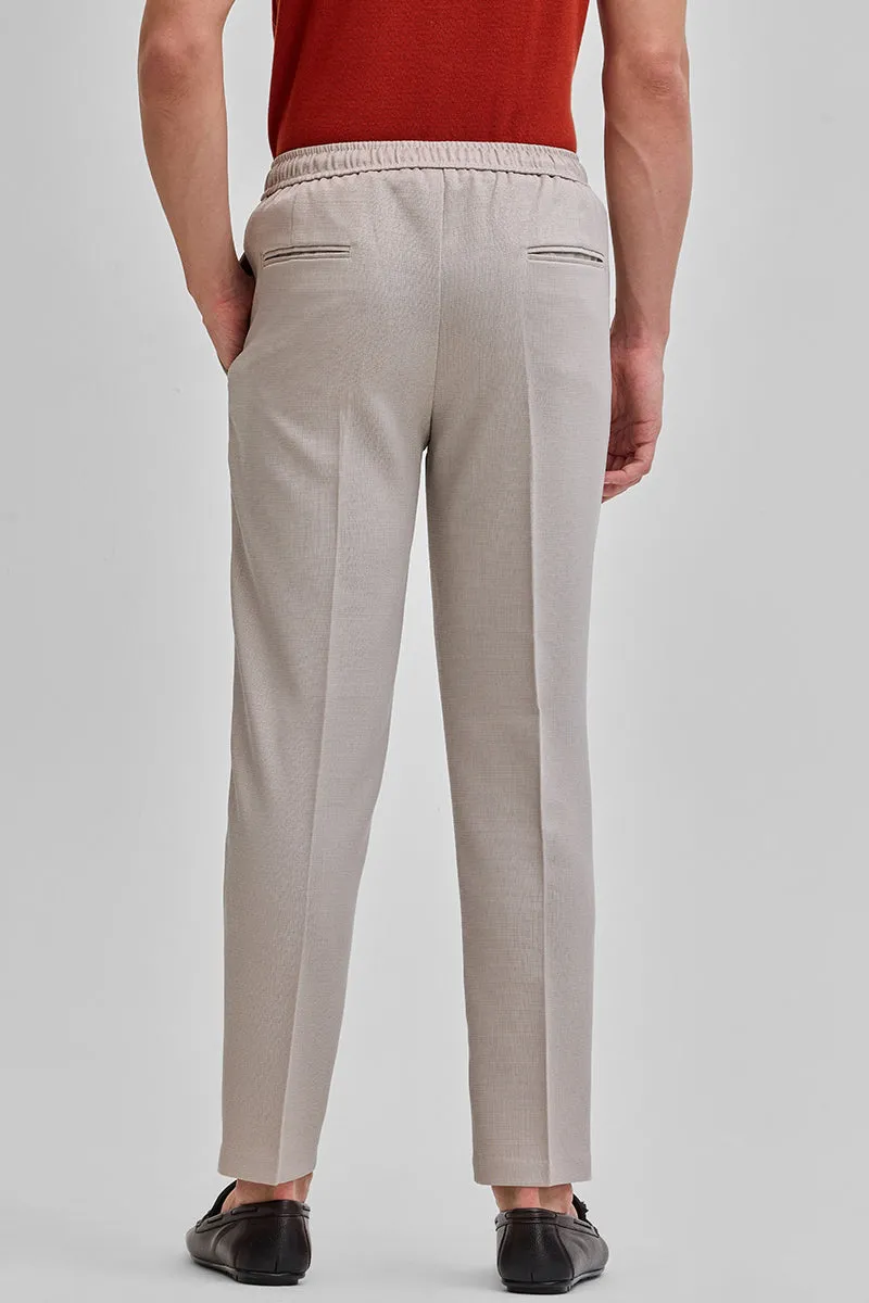 Beige Textured Relaxed Fit Trousers