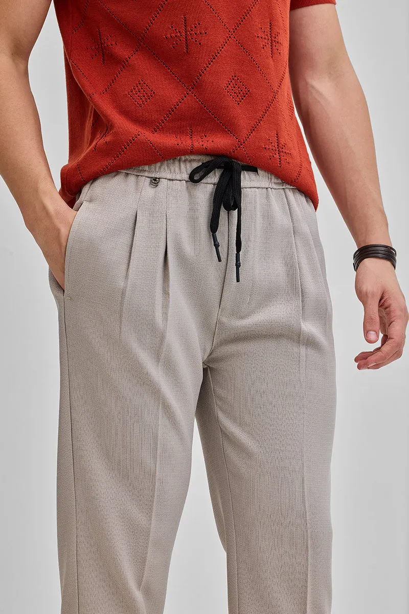 Beige Textured Relaxed Fit Trousers