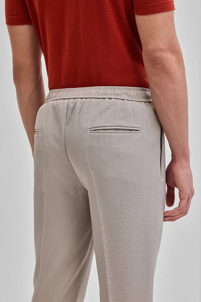 Beige Textured Relaxed Fit Trousers